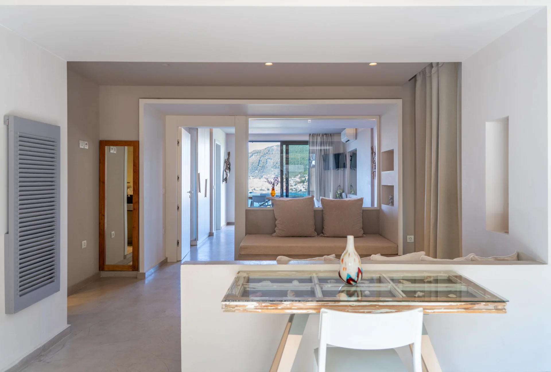The open-plan living and dining area of the family suite in the Patrick Family Suite at CORE Luxury Suites, Skiathos.