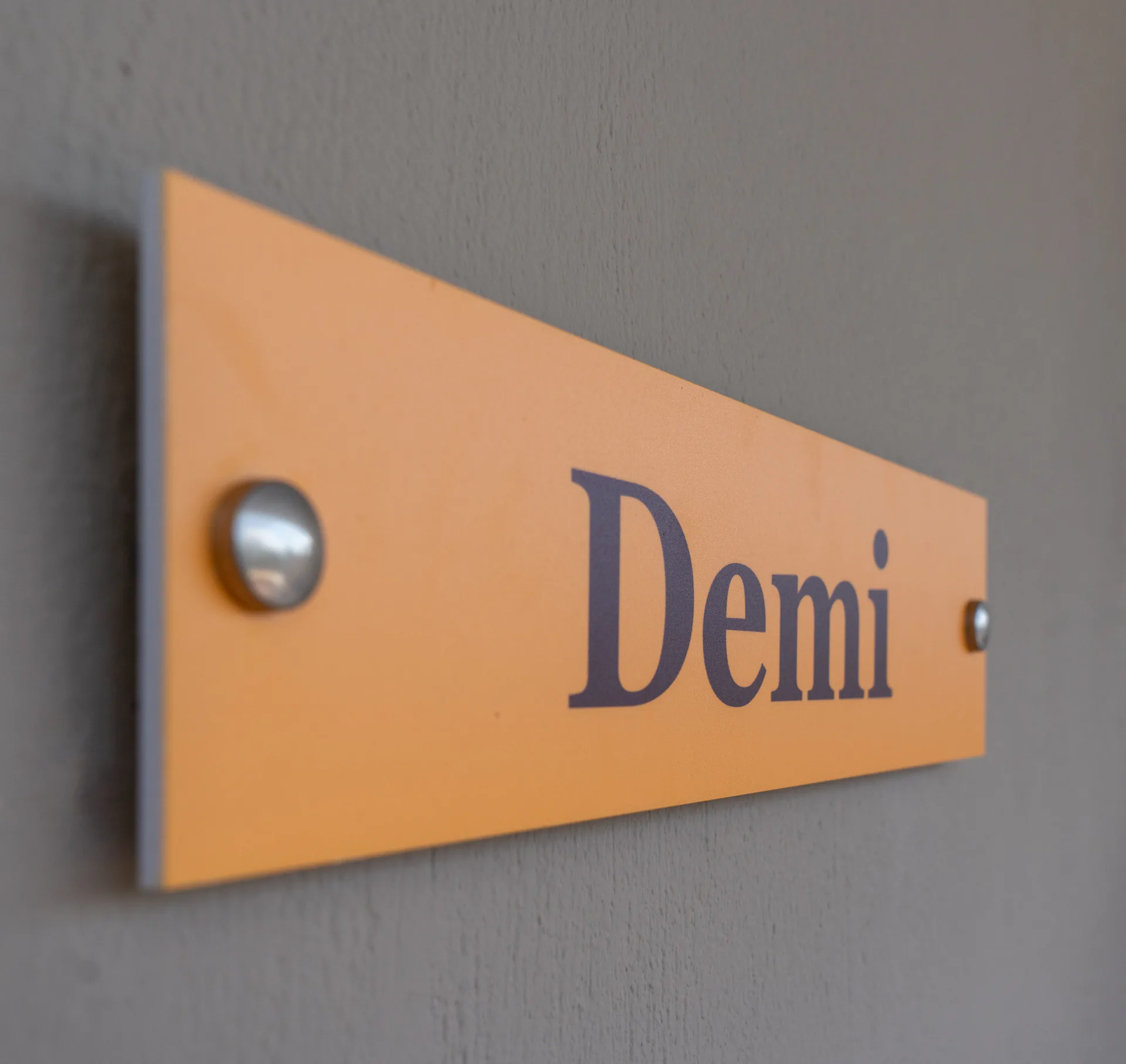 The suite's amber name plaque beside its door in the Demi Classic Suite at CORE Luxury Suites, Skiathos.
