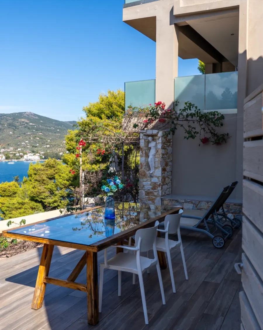 A terrace at CORE with bougainvillea over the stone